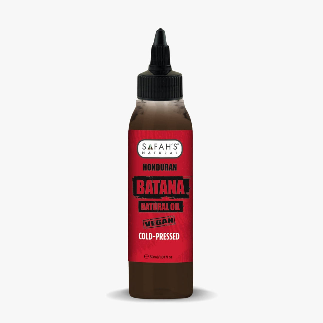 Bottle of Safah's Honduran Batana natural oil with a red label on a white background