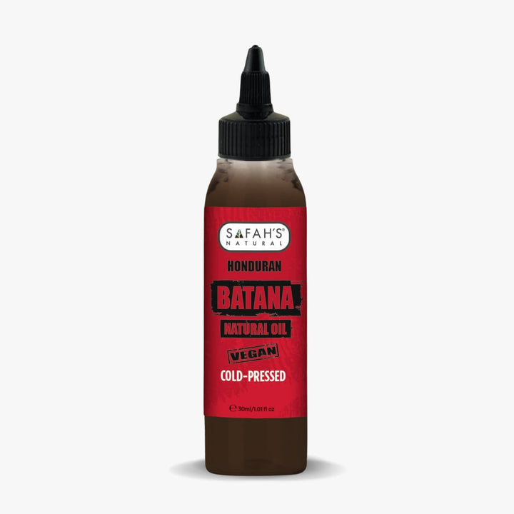 Bottle of Safah's Honduran Batana natural oil with a red label on a white background